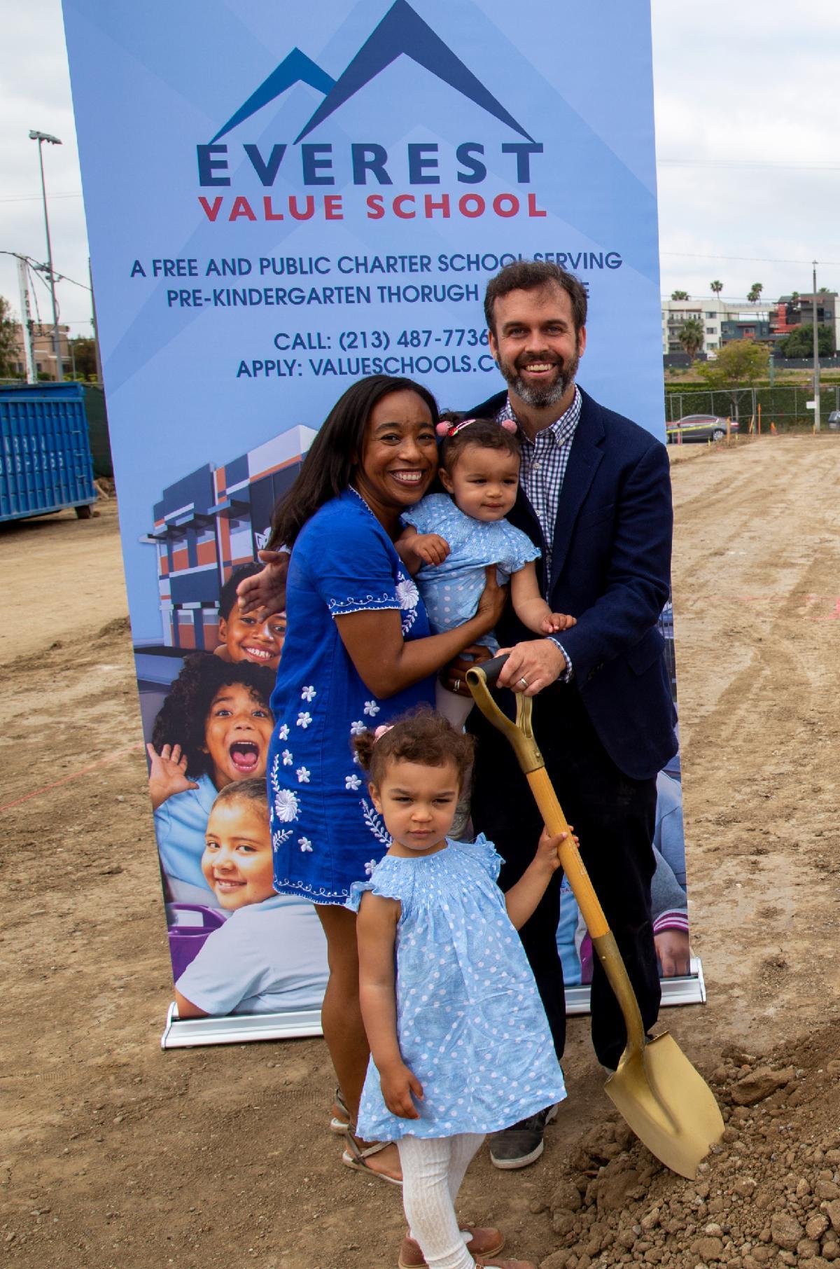 Principal Chris Medinger with his family during Everest Value School's groundbreaking.