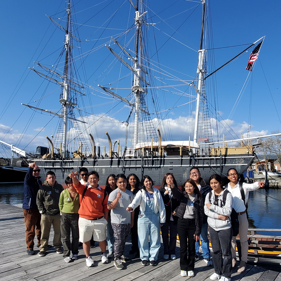 Students at the Mystic Seaport Museum with Value Schools alumna Casey Frye.