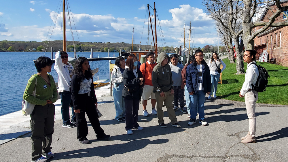 Students at the Mystic Seaport Museum with Value Schools alumna Casey Frye.