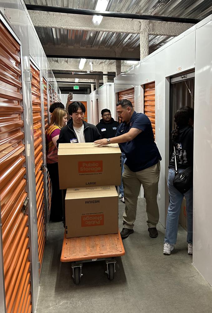 Annie Wu, Julie Turner, Senior Regional Manager, and other Public Storage employees with our students as they competed in a timed reorganization challenge.