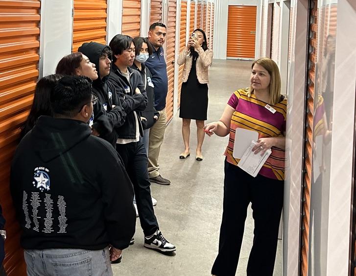 Annie Wu, Julie Turner, Senior Regional Manager, and other Public Storage employees with our students as they competed in a timed reorganization challenge.